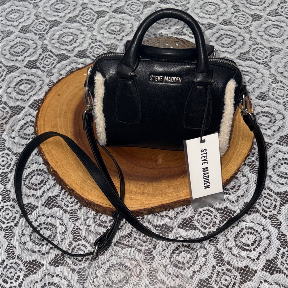 Steve Madden BFABLE crossbody bag in black with a sherpa trim.